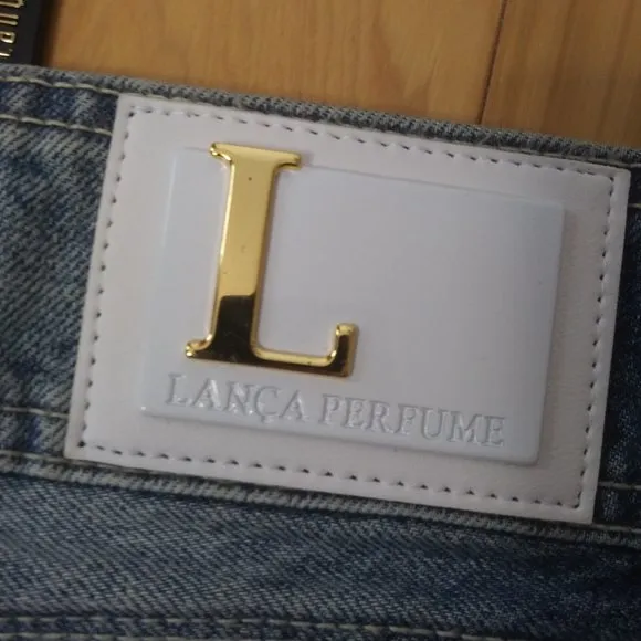 - NWOT Lanca Perfume sexy distressed cotton denim mini skirt lots of branding