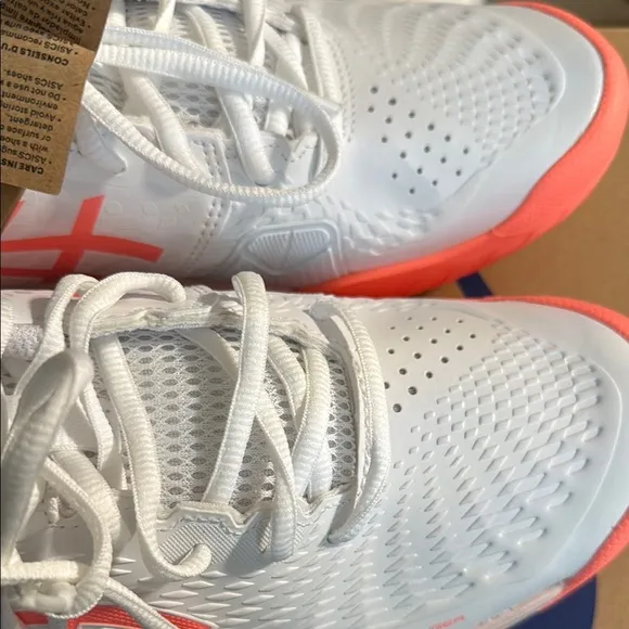 Asics White and Orange Athletic Shoes with Sleek Design