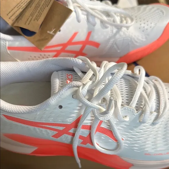 Asics White and Orange Athletic Shoes with Sleek Design