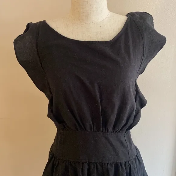 Free People linen blend beautiful ruffled back tie mini boho dress.
