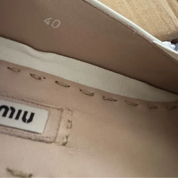 Miu Miu Off White Leather Slip-On Shoes with Silver Accents