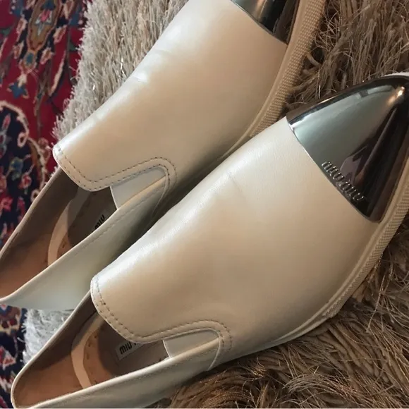 Miu Miu Off White Leather Slip-On Shoes with Silver Accents