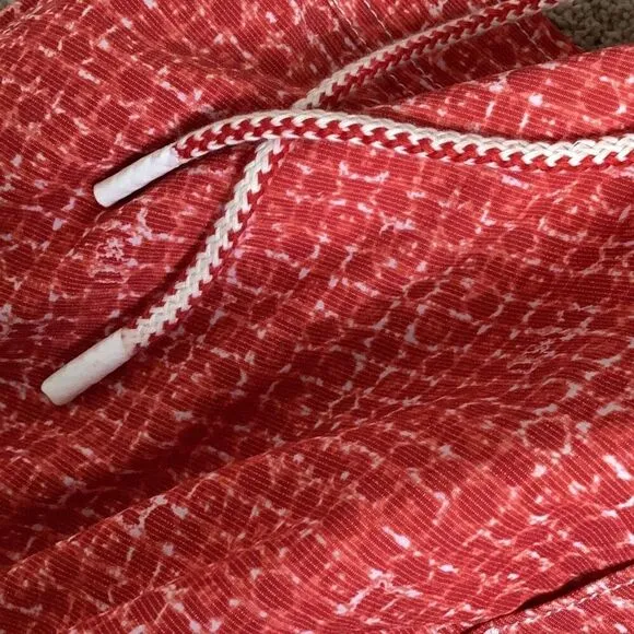 New. Johnnie-O red swim shorts. Small. Retails $89