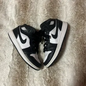 Nike Black and White High-Top Boots