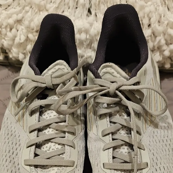 Saucony Athletic Shoes with Breathable Fabric and Curved Sole