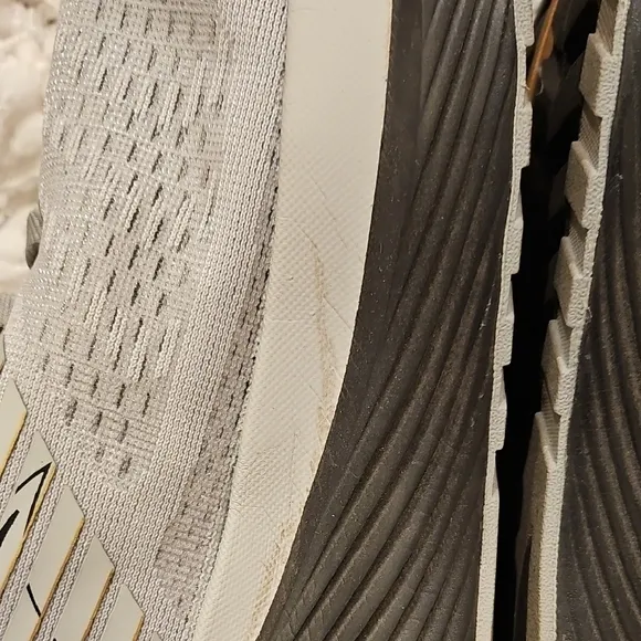 Saucony Athletic Shoes with Breathable Fabric and Curved Sole