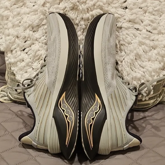 Saucony Athletic Shoes with Breathable Fabric and Curved Sole
