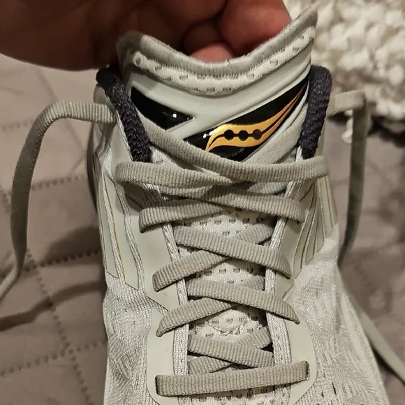 Saucony Athletic Shoes with Breathable Fabric and Curved Sole