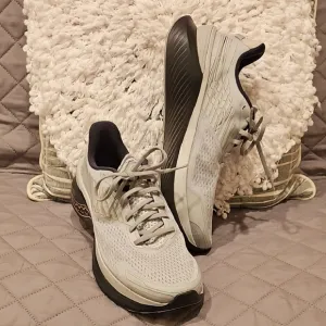Saucony Athletic Shoes with Breathable Fabric and Curved Sole