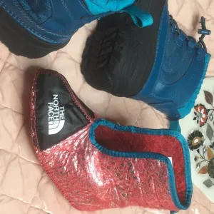 The North Face kids Alpenglow Thermafelt boots with inserts in both boots