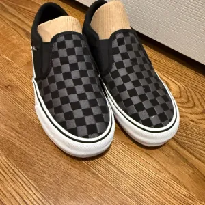 Vans Men's Black Checkered Slip-On Shoes size 7